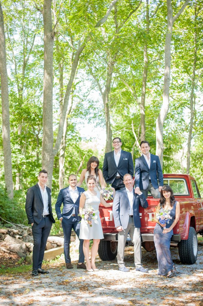 Hamptons wedding photographer captures two grooms for a same sex wedding at a private home with a wedding party in navy and grey. Images by Mikkel Paige Photography.