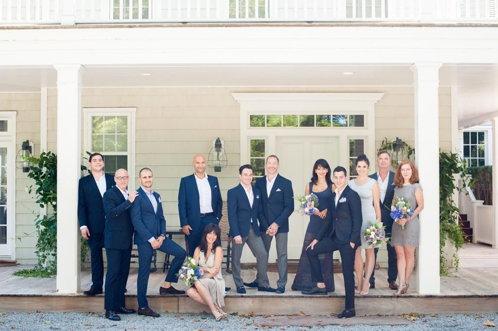 Hamptons wedding photographer captures two grooms for a same sex wedding at a private home with a wedding party in navy and grey. Images by Mikkel Paige Photography.