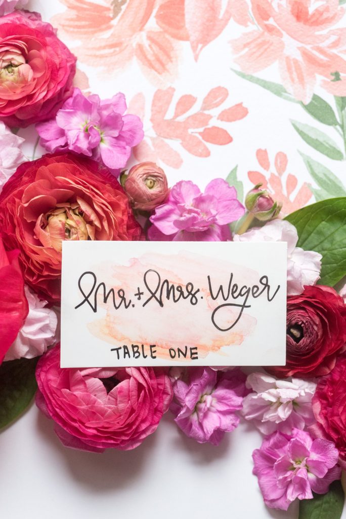 Flat lay styling for destination weddings and events by Mikkel Paige Photography. This brightly colored hand painted stationery, designed by One and Only Paper, was for a luxury wedding in downtown Raleigh, North Carolina.