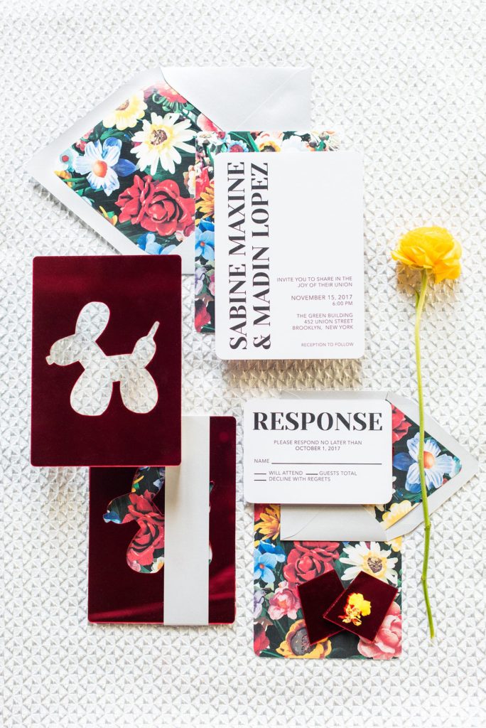 Flat lay styling for destination weddings and events by Mikkel Paige Photography. This stationery suite was for a city luxury wedding by planner Color Pop Events, at the Green Building in Brooklyn, New York.