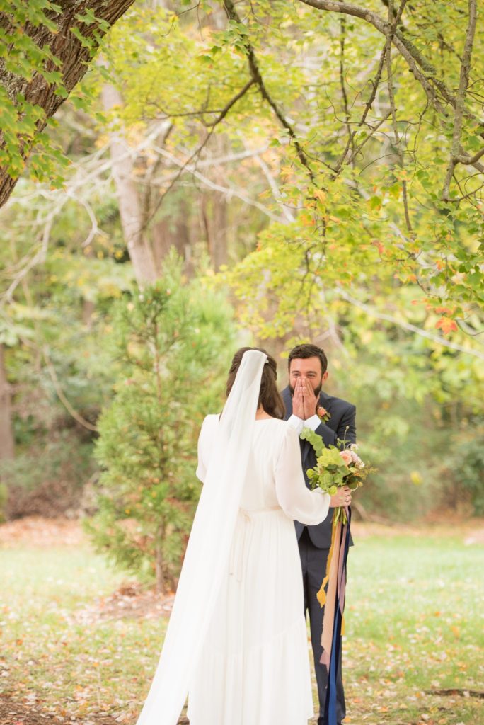 Small wedding in North Carolina with photos by Mikkel Paige Photography. The bride and groom got married in an intimate setting at historic Leslie-Alford Mims House in Cary and he was emotional during their first look.
