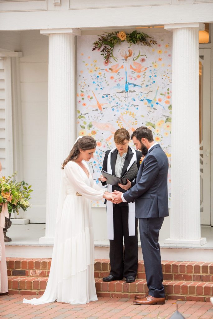 Small wedding in North Carolina with photos by Mikkel Paige Photography. The bride and groom got married in front of historic Leslie-Alford Mims House in Cary.