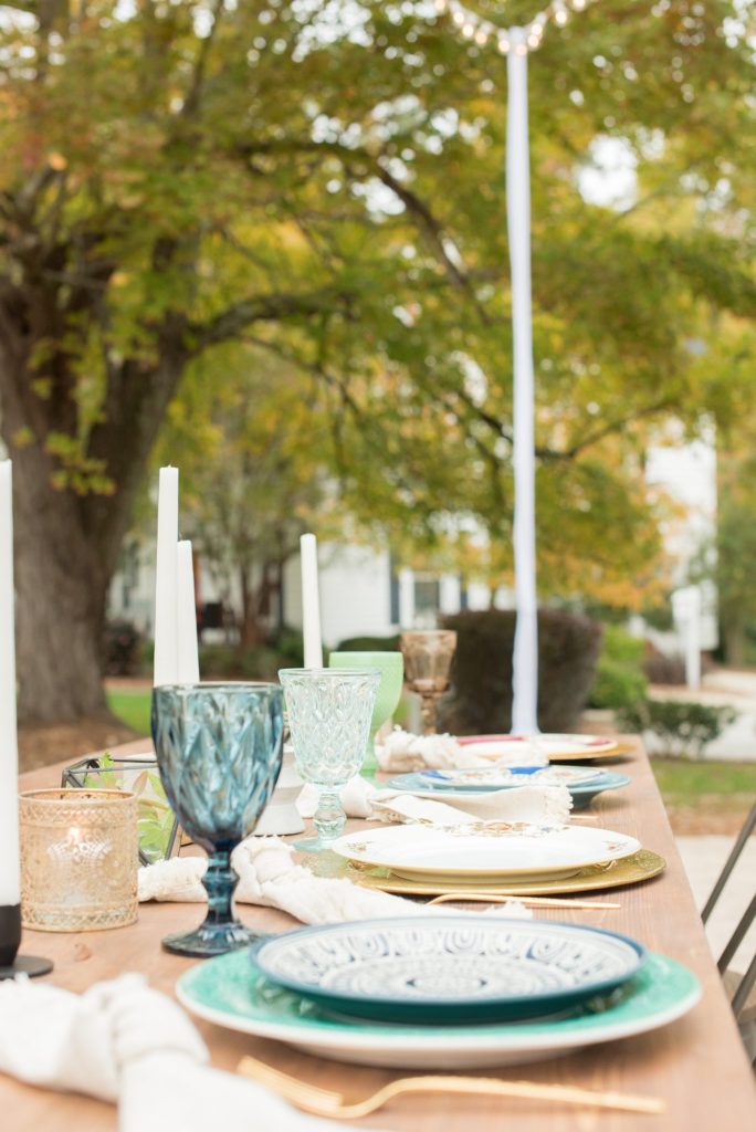 Small wedding in North Carolina with photos by Mikkel Paige Photography. The intimate reception for less than 50 people had mixed seating and jewel tone plates and various colorful glasses.