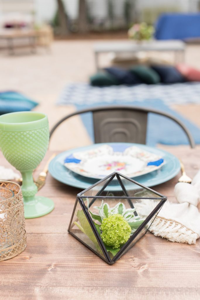 Small wedding in North Carolina with photos by Mikkel Paige Photography. The intimate reception for less than 50 people had mixed seating and jewel tone plates and various colorful glasses.