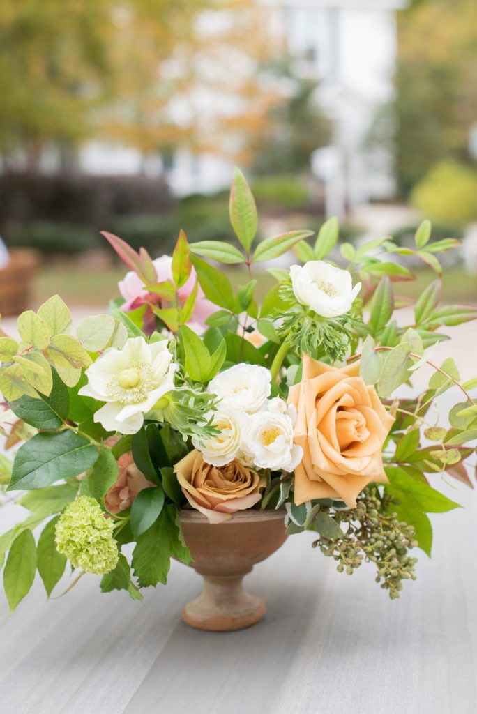Small wedding in North Carolina with photos by Mikkel Paige Photography. The bride and groom got married in an intimate setting at historic Leslie-Alford Mims House in Cary. The intimate reception was for less than 50 people and had fall floral centerpieces on tables.