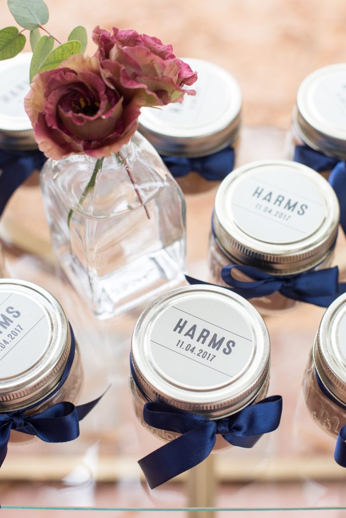 Small wedding in North Carolina with photos by Mikkel Paige Photography. The bride and groom got married in an intimate setting at historic Leslie-Alford Mims House in Cary. The intimate reception was for less than 40 people and the couple made custom candles for their guests that they tied with blue ribbon and displayed on a diamond shelf stand.