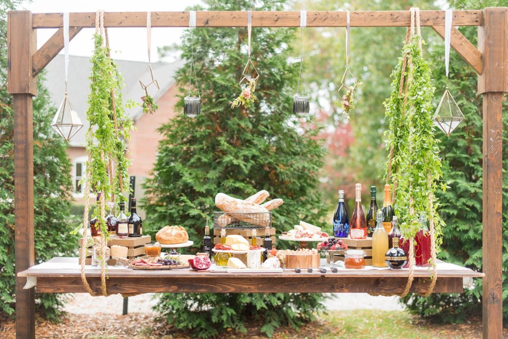 Small wedding ideas with photos by Mikkel Paige Photography. This reception was for less than 50 people and had a cheese, wine and fruit table suspended from a top beam for a creative way to serve the intimate guest list.