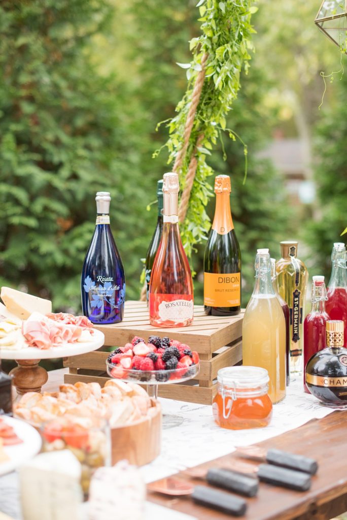 Small wedding ideas with photos by Mikkel Paige Photography. This reception was for less than 50 people and had a cheese, wine and fruit table suspended from a top beam for a creative way to serve the intimate guest list.