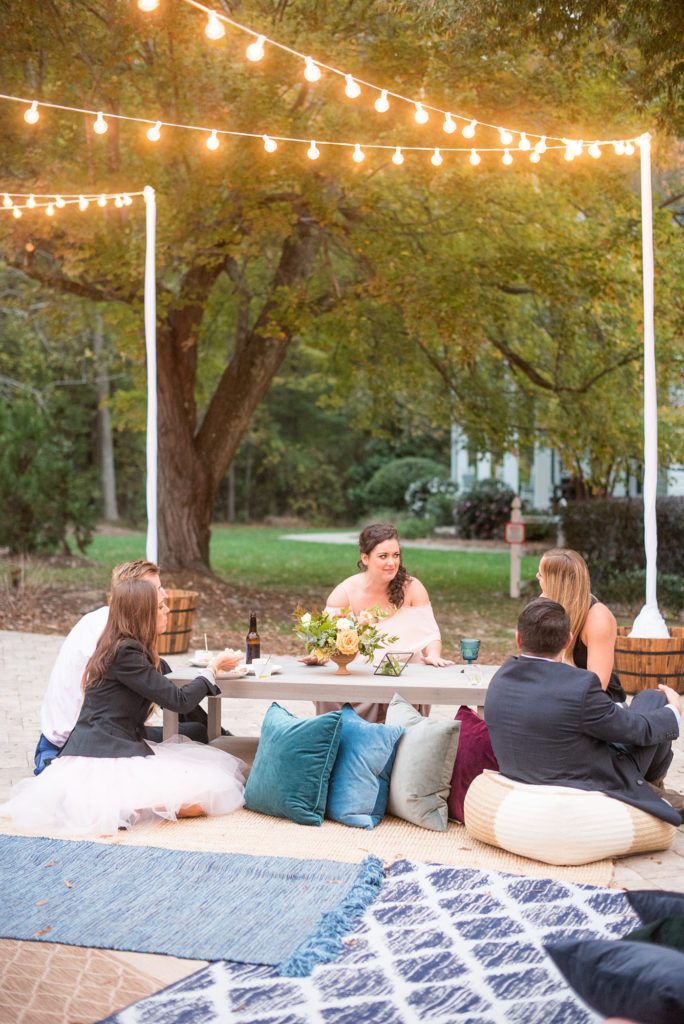 Small wedding in North Carolina with photos by Mikkel Paige Photography. The reception for less than 50 people had mixed seating and jewel tones.