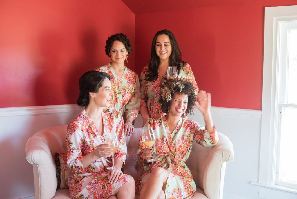 An intimate destination wedding elopement for a vineyard wedding in California at HammerSky Vineyards with Mikkel Paige Photography. The bride and her bridesmaids got ready for the wedding in matching floral robes.