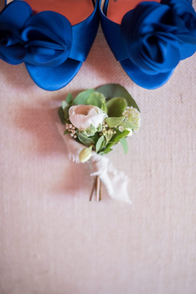 An intimate destination wedding elopement for a vineyard wedding in California at HammerSky Vineyards with Mikkel Paige Photography. The groom wore a ranunculus boutonniere.