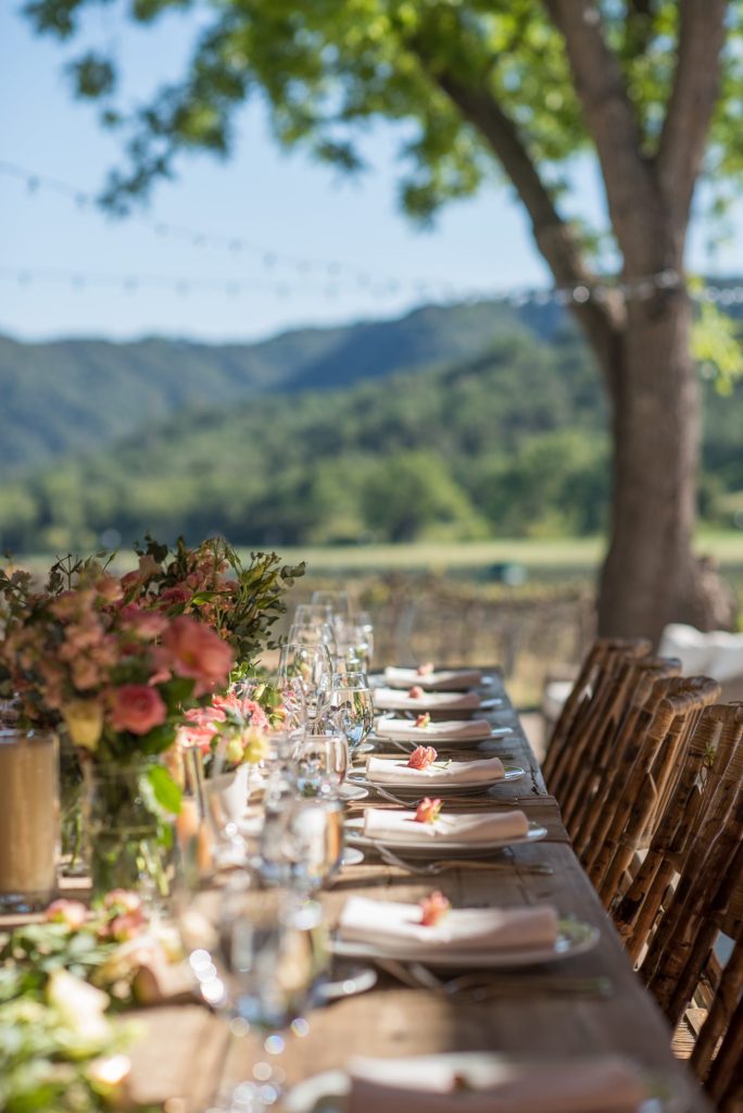 A small destination wedding elopement reception in a barn for a vineyard wedding in California at HammerSky Vineyards with Mikkel Paige Photography.