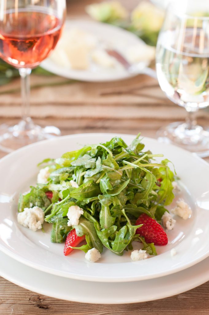Arugula salad for a small destination wedding elopement reception in a barn for a vineyard wedding in California at HammerSky Vineyards with Mikkel Paige Photography.