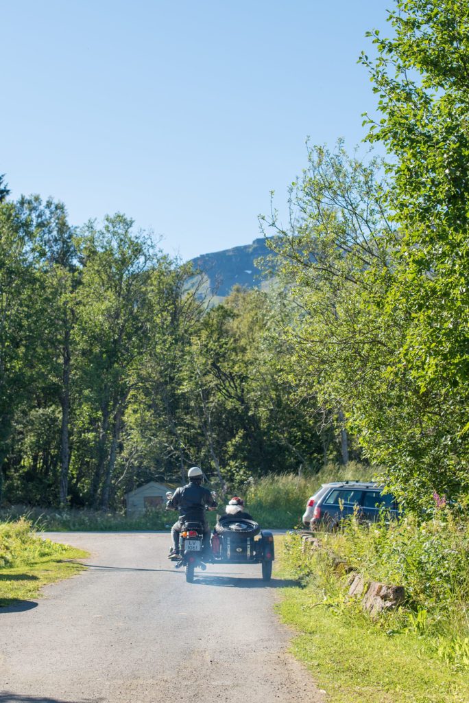 Norway Destination wedding photos by Mikkel Paige Photography with an outdoor ceremony in the Arctic Circle and a motorcycle and sidecar getaway vehicle for the bride and groom.