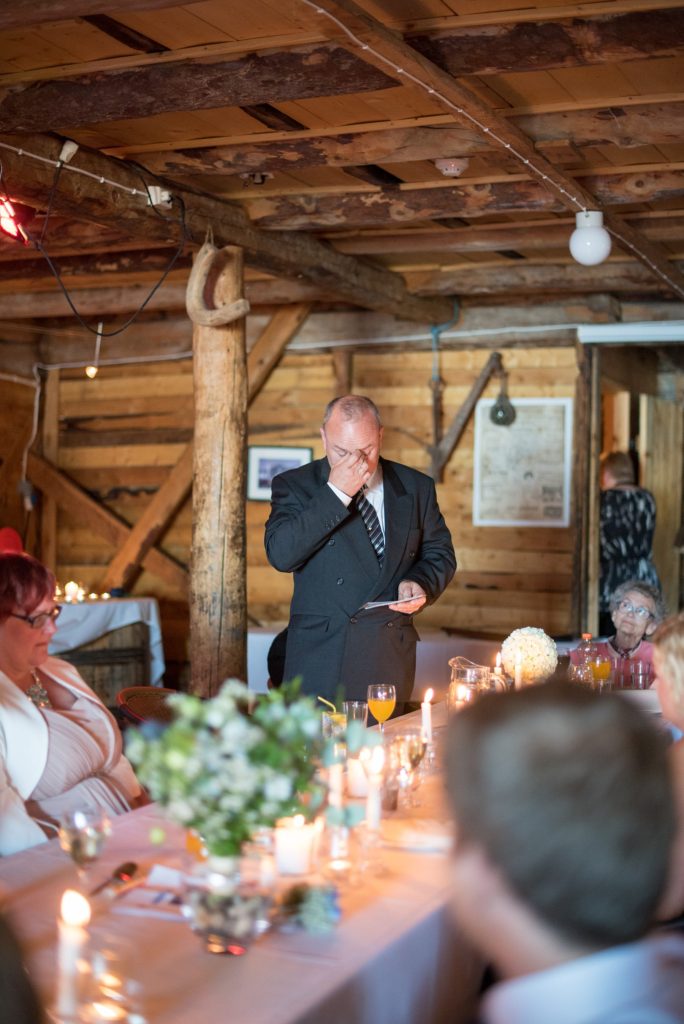 Norway Destination wedding photos by Mikkel Paige Photography in the Arctic Circle. The bride and groom had a dinner reception with family on the water.