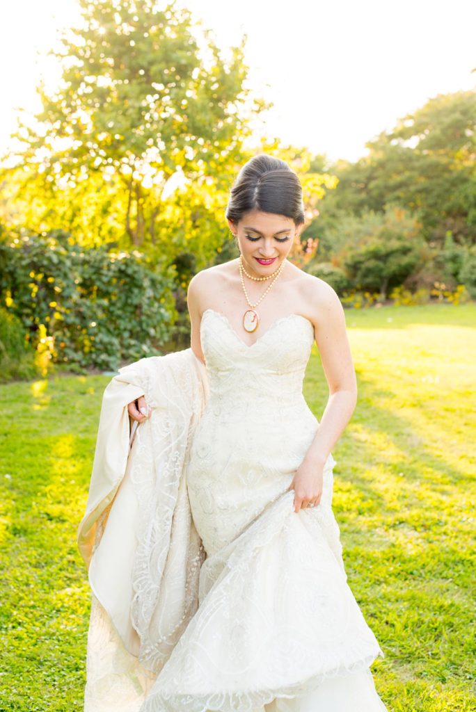 A bride walks through a garden in Raleigh, NC captured by Mikkel Paige photography.