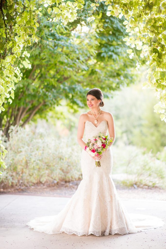 A bride walks through a garden in Raleigh, NC captured by Mikkel Paige photography.