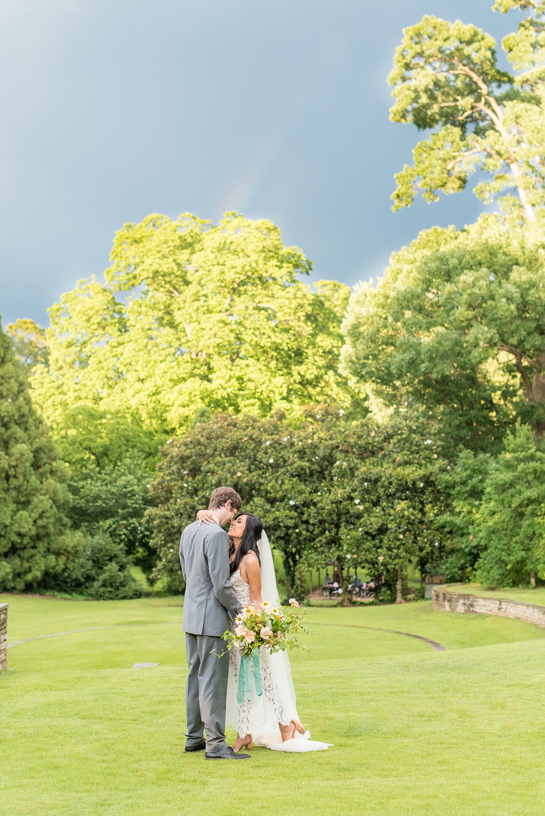 A couple was rewarded with an elopement rainbow after putting up with the storm of Coronavirus and changing their original wedding plans. Small outdoor ceremony in Raleigh, NC captured by Mikkel Paige Photography. #mikkelpaige #raleighelopement #raleighsmallwedding 