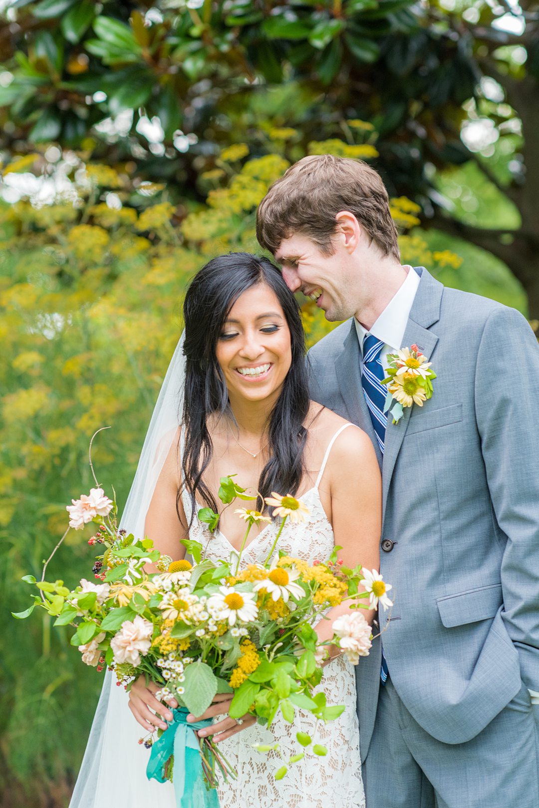 The bride and groom eloped and went to the alternative plan when Coronavirus foiled their original wedding. Wildflowers completed an outdoor ceremony in Raleigh, NC photographed by Mikkel Paige Photography. Hair and makeup by Wink, flowers by Mood Fleuriste. #mikkelpaige #raleighelopement #smalloutdoorceremony