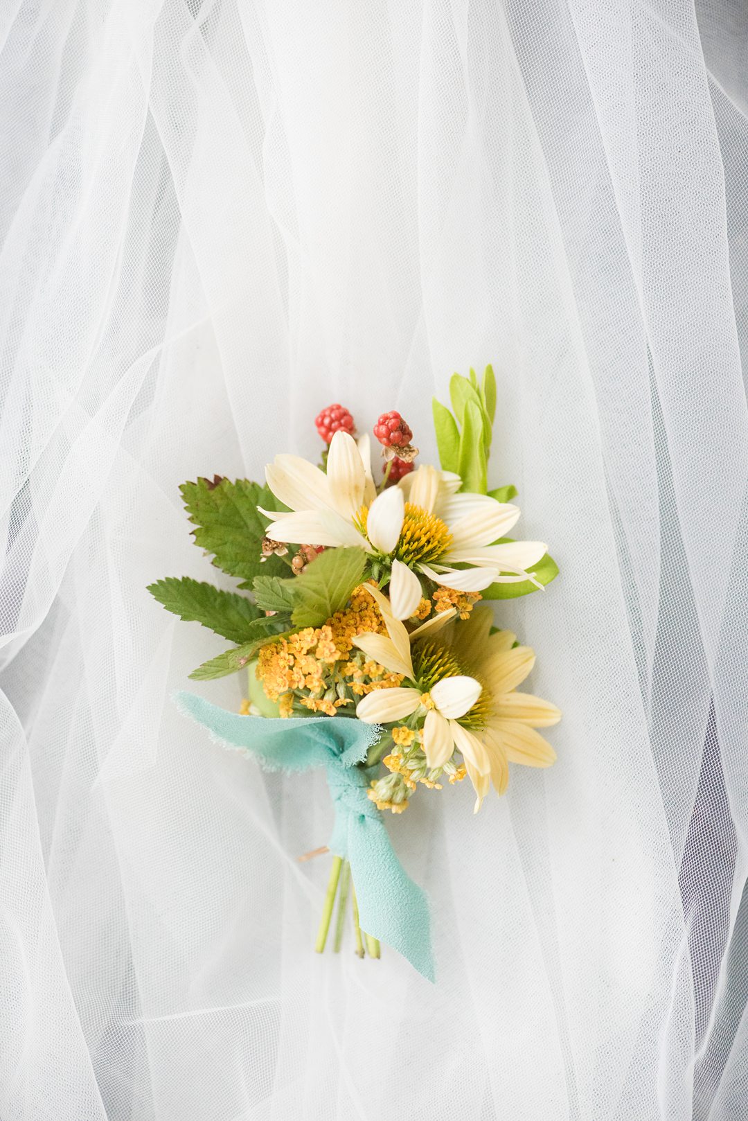 A wildflower boutonniere photographed by Mikkel Paige Photography and created by Mood Fleuriste. The couple eloped when COVID-19 changed their original plan.