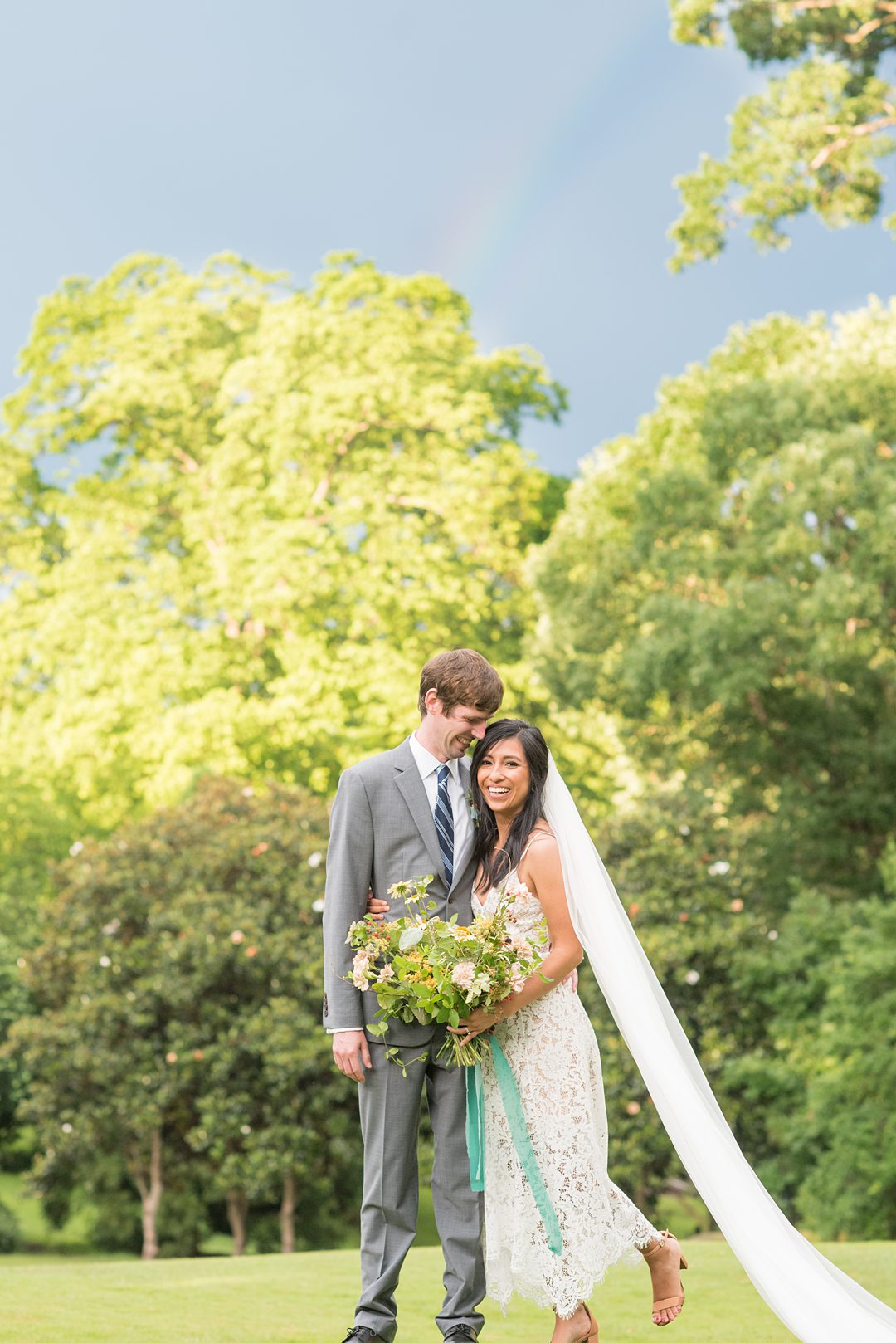 A rainbow appeared after a bride and groom's small outdoor elopement ceremony in Raleigh, North Carolina. Photos by Mikkel Paige Photography. #mikkelpaige #raleighweddings #smallwedding #ncelopement