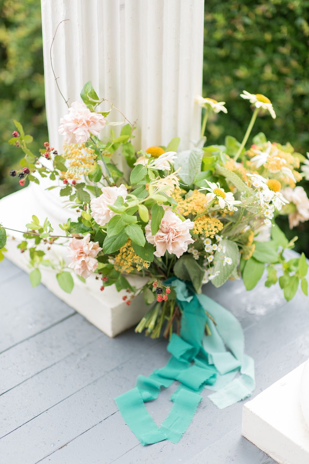 A wildflower bridal bouquet photographed by Mikkel Paige Photography and created by Mood Fleuriste. The couple eloped when COVID-19 changed their original plan.