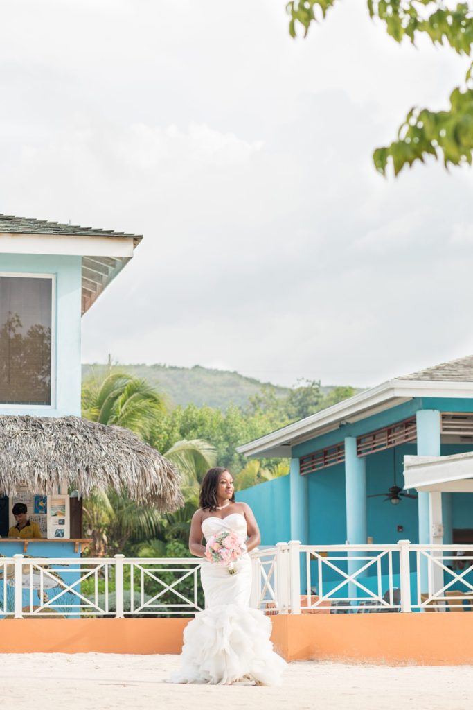 Jamaica wedding photographer at Iberostar resort with a bride in the sand.