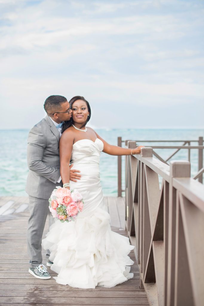 Jamaica wedding photographer at Iberostar resort with a bride and groom at the water.