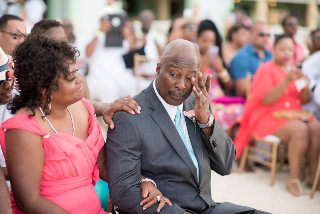 Father of the bride crying at a wedding in Jamaica wedding at Iberostar resort with an oceanfront ceremony.