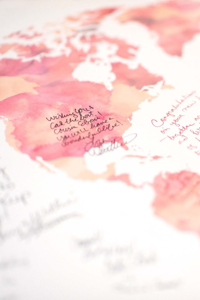 Map poster signed by guests at a wedding in Jamaica, photographed by Mikkel Paige Photography.