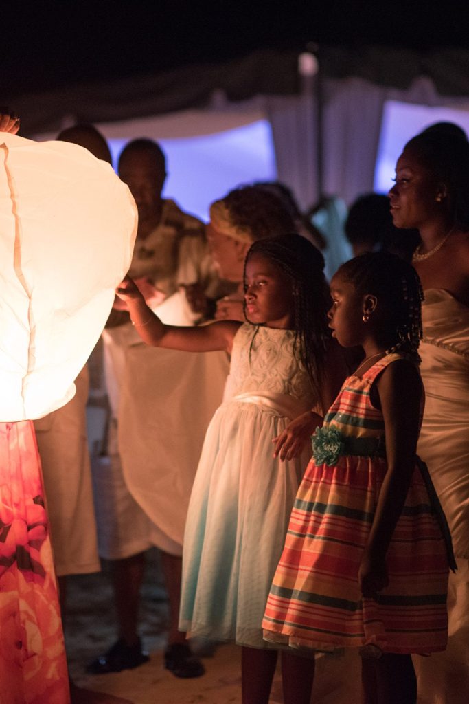 Evening lantern send off on the beach at a wedding in Jamaica, photographed by Mikkel Paige Photography.