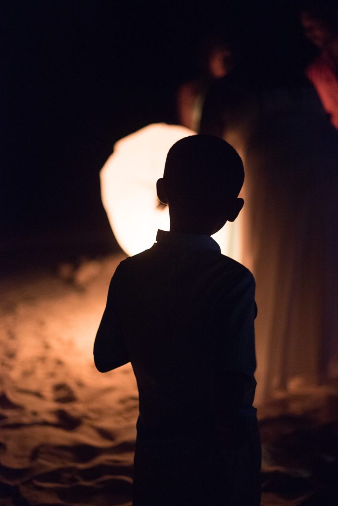 Evening lantern send off on the beach at a wedding in Jamaica, photographed by Mikkel Paige Photography.
