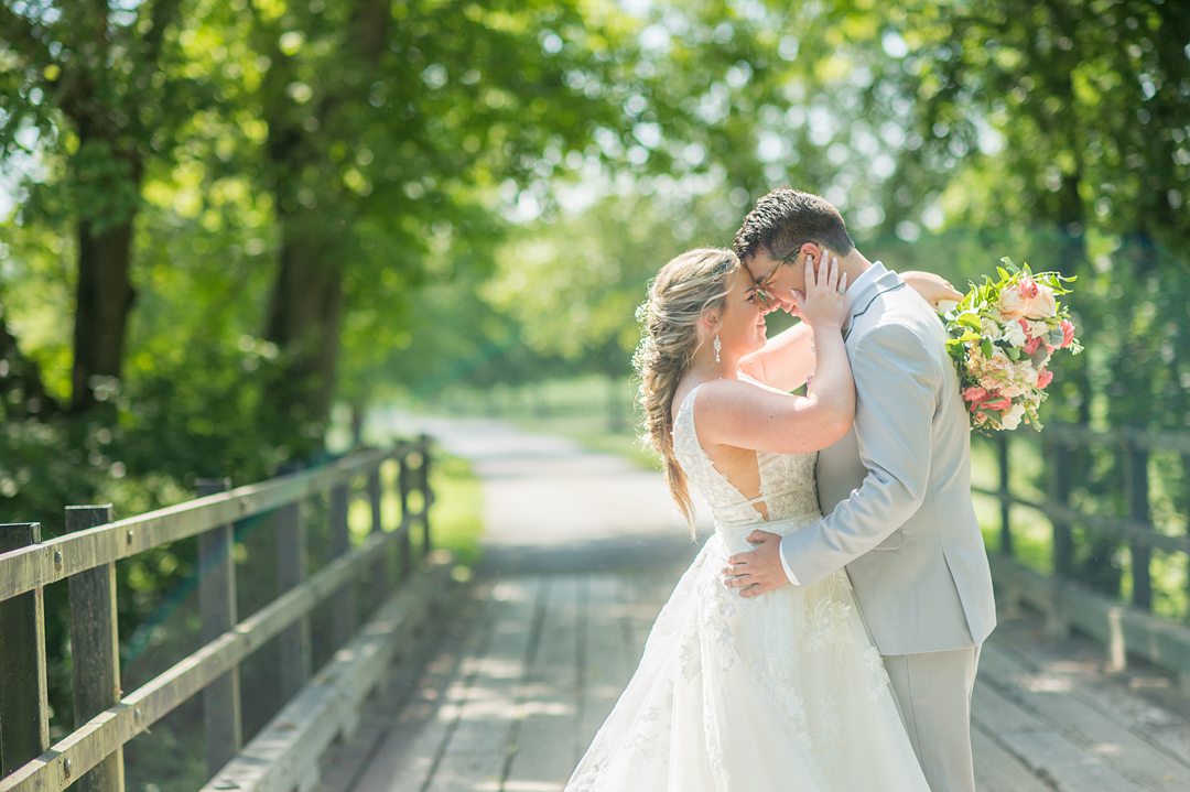 Bride and groom in the woods during their Charlottesville, VA wedding at The Lodge at Mount Ida Farm. Pictures by Mikkel Paige Photography.