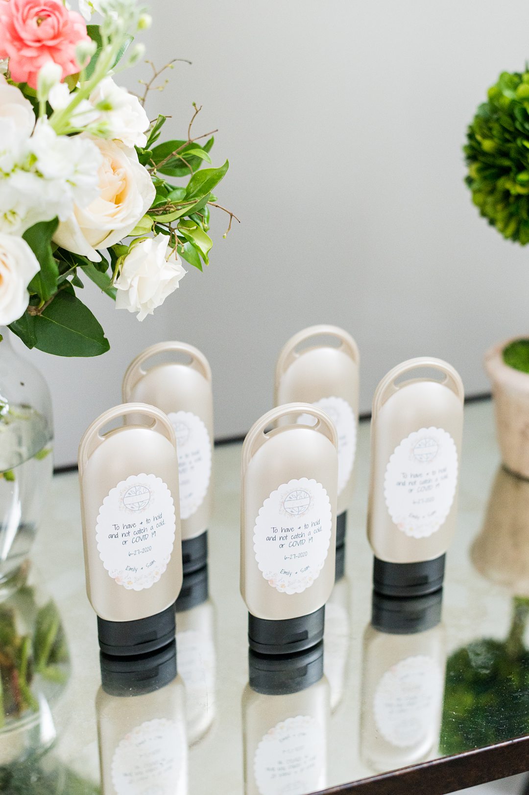 A couple pivoted during COVID-19 times for their wedding at The Lodge at Mount Ida Farm in Charlottesville, Virginia. Pictures by Mikkel Paige Photography of custom hand sanitizer favors for guests. #mikkelpaige #customhandsanitizer #weddingfavors