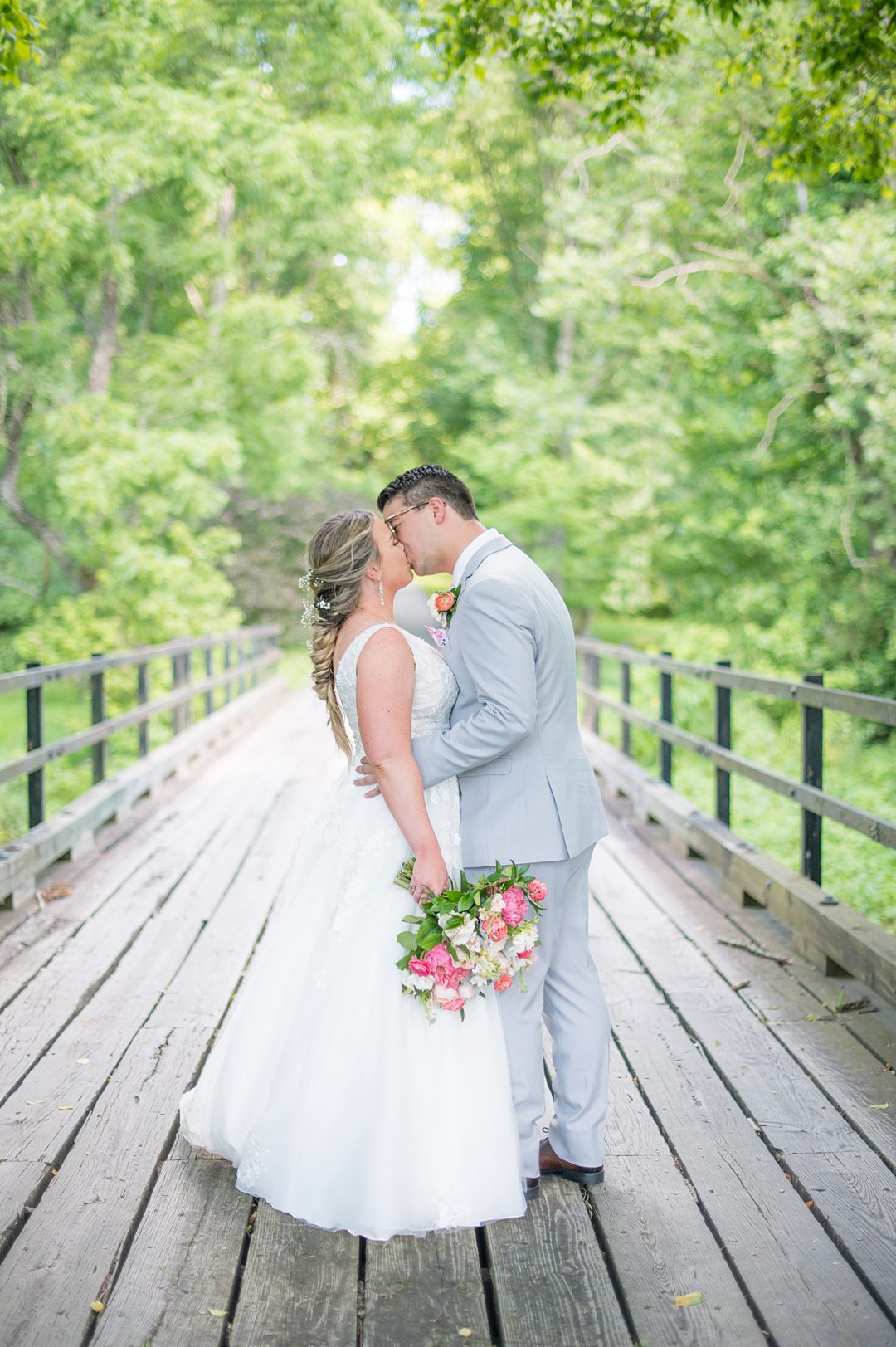 Bride and groom in the woods during their Charlottesville, VA wedding at The Lodge at Mount Ida Farm. Pictures by Mikkel Paige Photography.