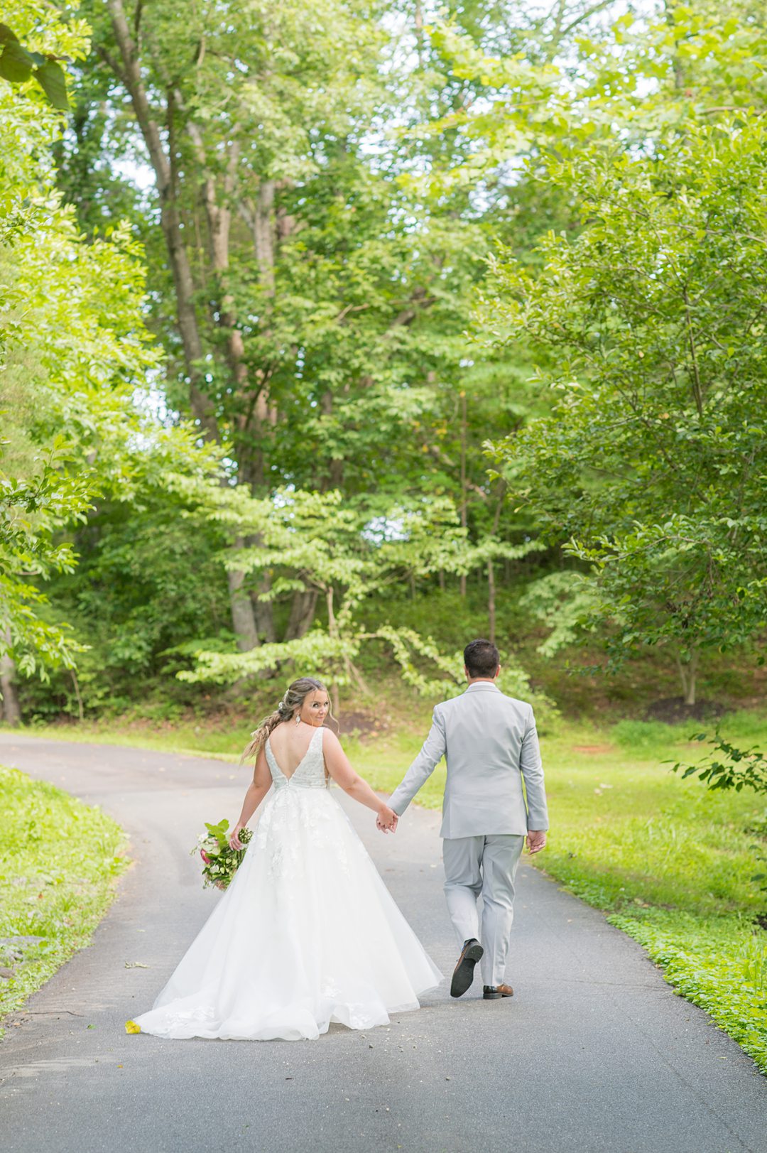 Bride and groom in the woods during their Charlottesville, VA wedding at The Lodge at Mount Ida Farm. Pictures by Mikkel Paige Photography.