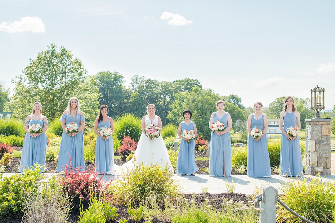 Bridal party in blue gowns for a small wedding in Charlottesville Virginia. Photos by Mikkel Paige Photography at the Lodge at Mount Ida Farm. #mikkelpaige #bridalparty #mountidafarm #charlottesvillewedding