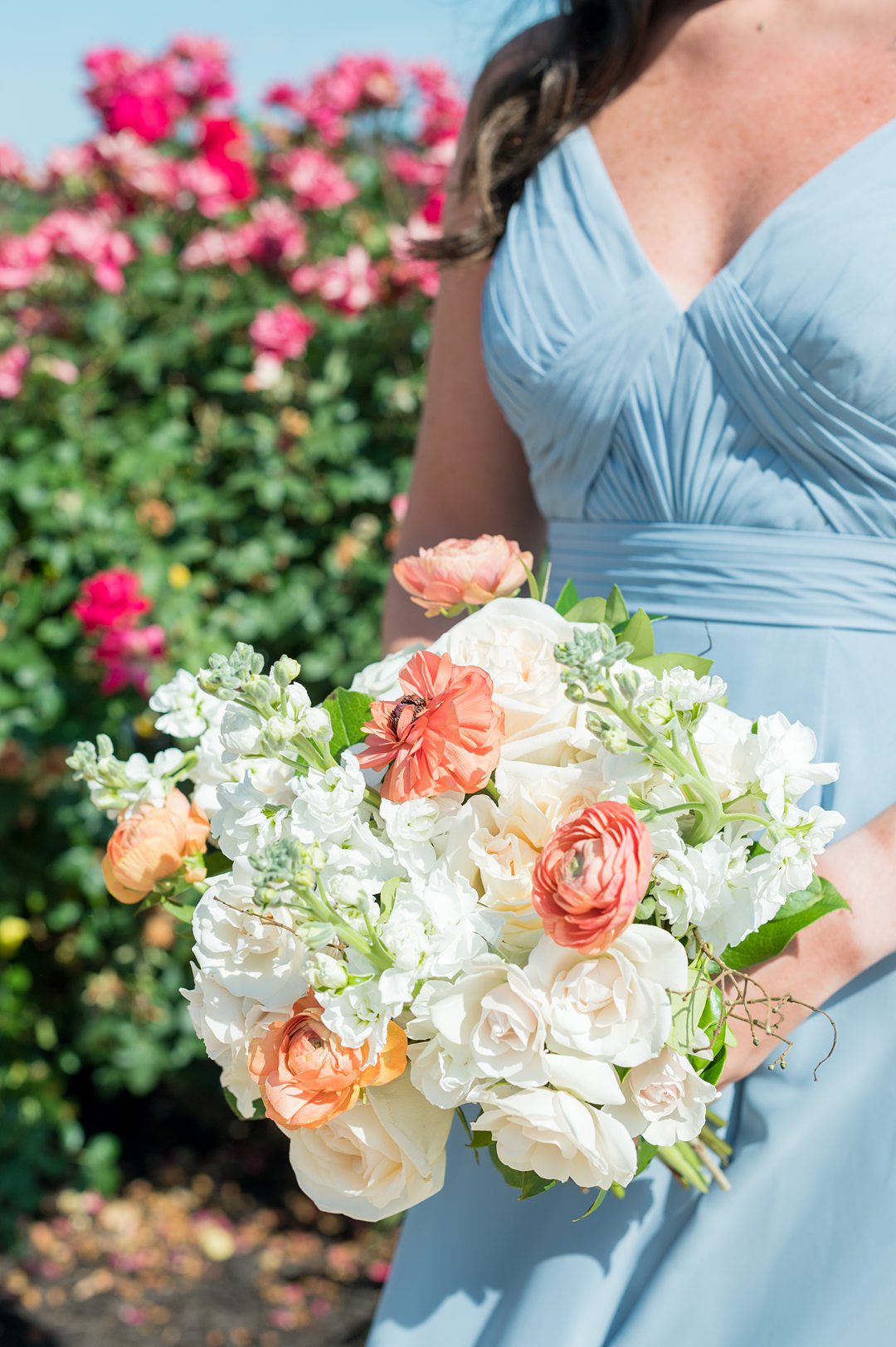 Bridesmaid bouquet of white and peach flowers including hydrangea and ranunculus, for a small wedding in Charlottesville, VA. Mikkel Paige Photography took pictures at The Lodge at Mount Ida Farm. Planning by Mary Elizabeth Events.