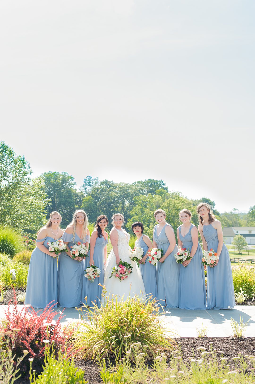 Bridal party in blue gowns for a small wedding in Charlottesville Virginia. Photos by Mikkel Paige Photography at the Lodge at Mount Ida Farm. #mikkelpaige #bridalparty #mountidafarm #charlottesvillewedding