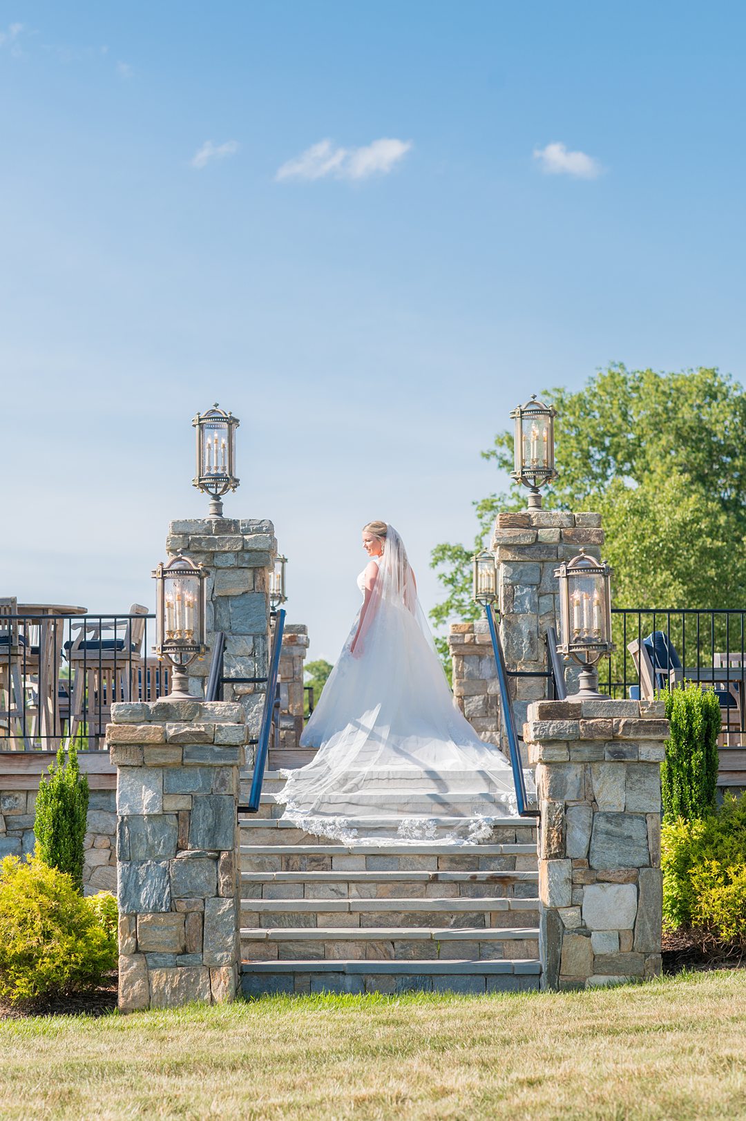 The bride wore a long veil for her wedding at The Lodge at Mount Ida Farm. Photographed by Mikkel Paige Photography.