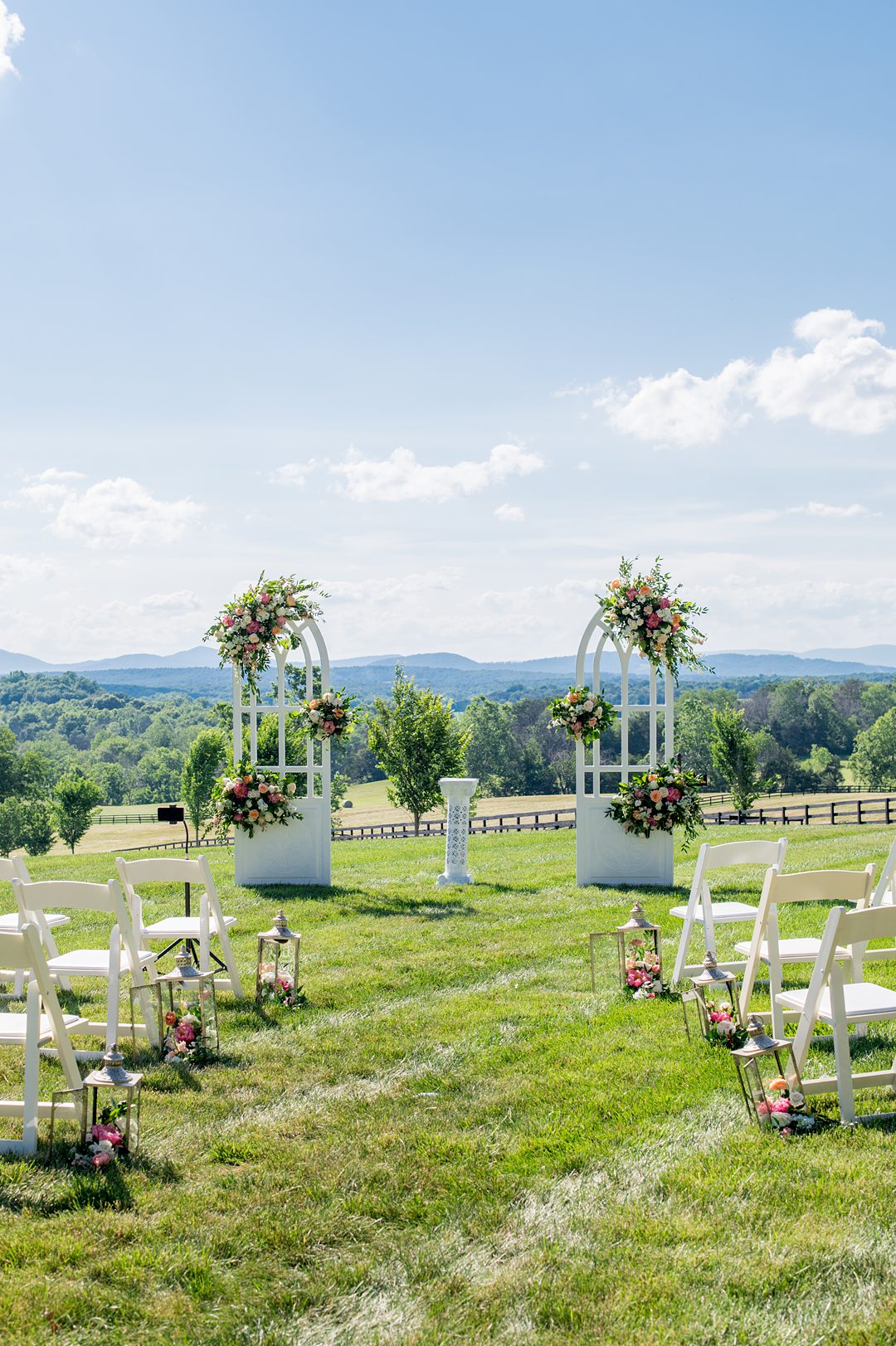 Small wedding ceremony details, in windows that were custom made and decorated with summer flowers. Photos by Mikkel Paige Photography at The Lodge at Mount Ida Farm in Charlottesville, VA. Planning by Mary Elizabeth Events. #mikkelpaige #Charlottesvillewedding #picturesqueceremony