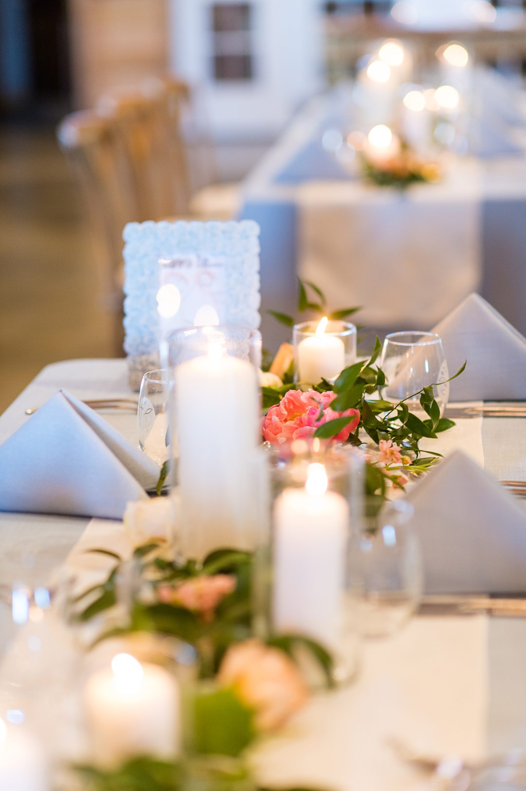 Candles lined the table during a small wedding reception at The Lodge at Mount Ida Farm in Charlottesville, VA. Photos by Mikkel Paige Photography.