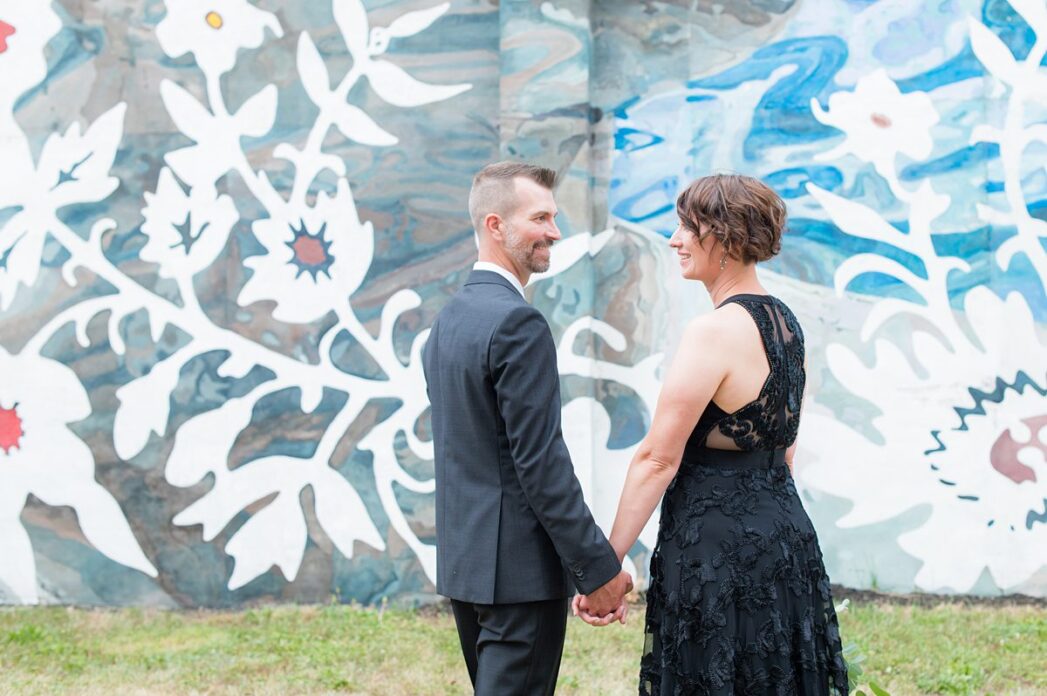 Bride and groom in front of a mural in Harrisburg, Pennsylvania