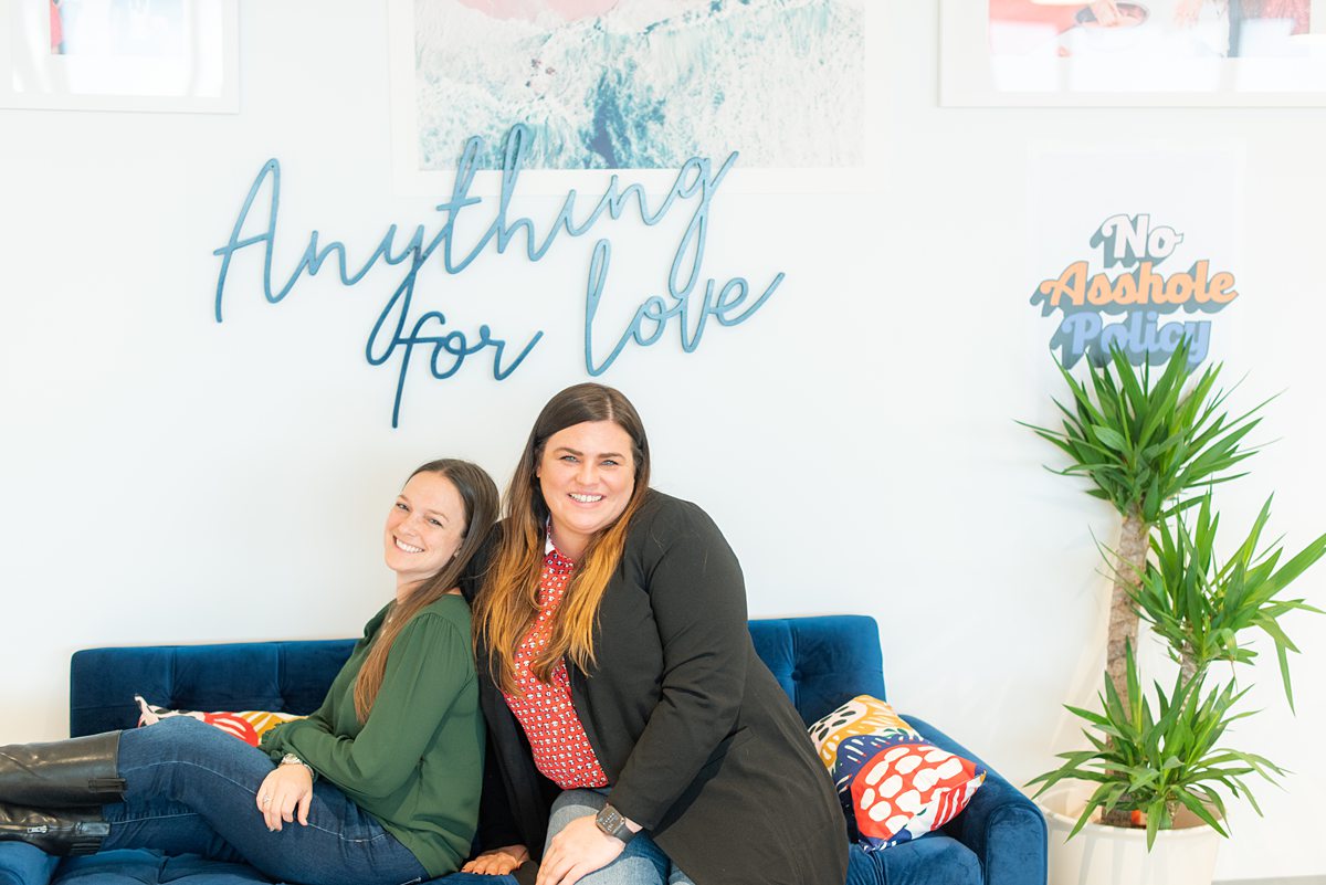 "Anything for Love" on a wall at Zola Headquarters. A look behind the scenes of the wedding website and app by Mikkel Paige Photography.