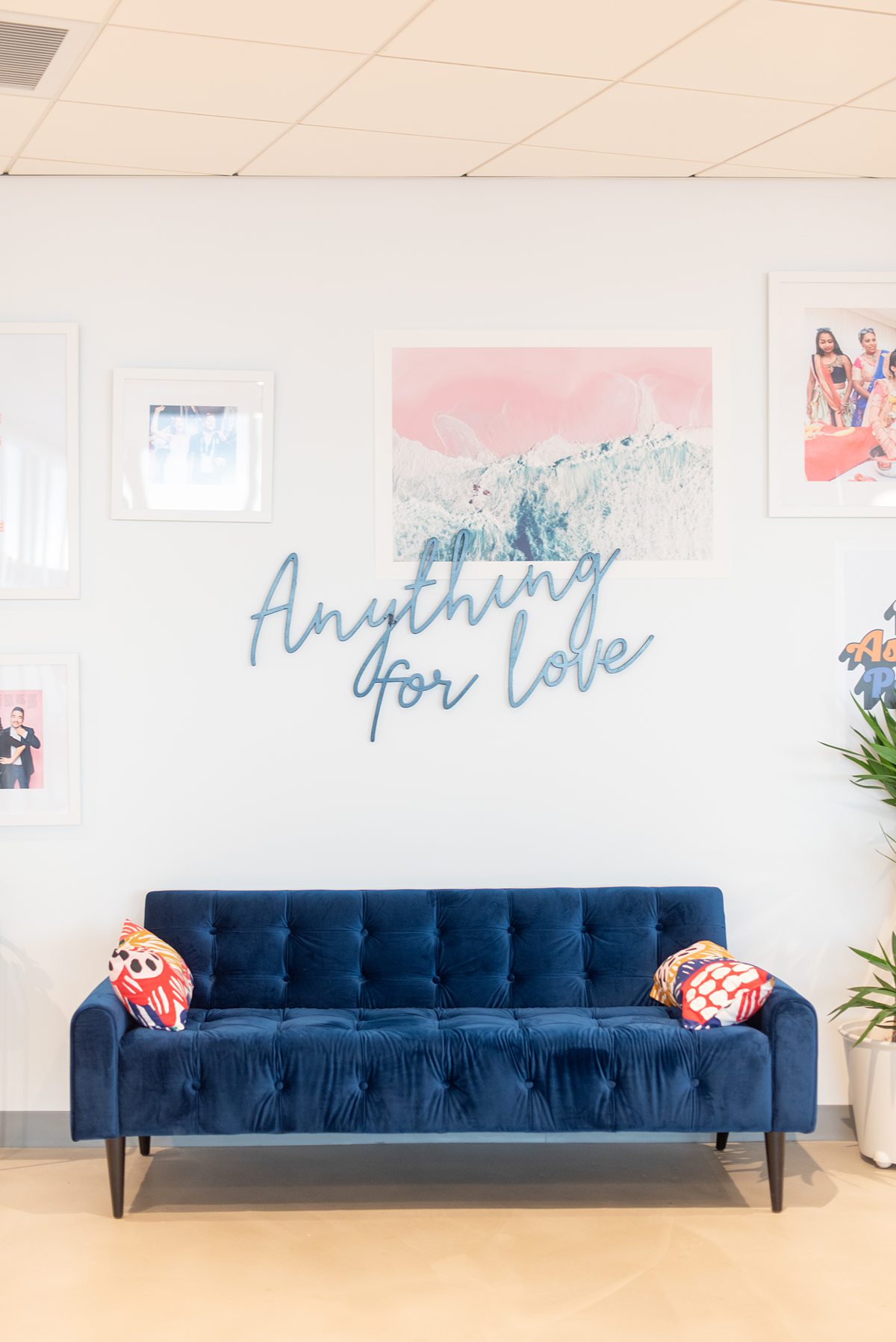"Anything for Love" on a wall at Zola Headquarters. A look behind the scenes of the wedding website and app by Mikkel Paige Photography.