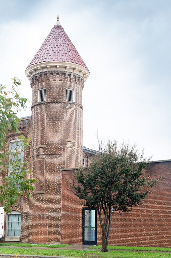 Brick turret of an old factory in Graham, NC, next to an event venue called The Graham Mill.