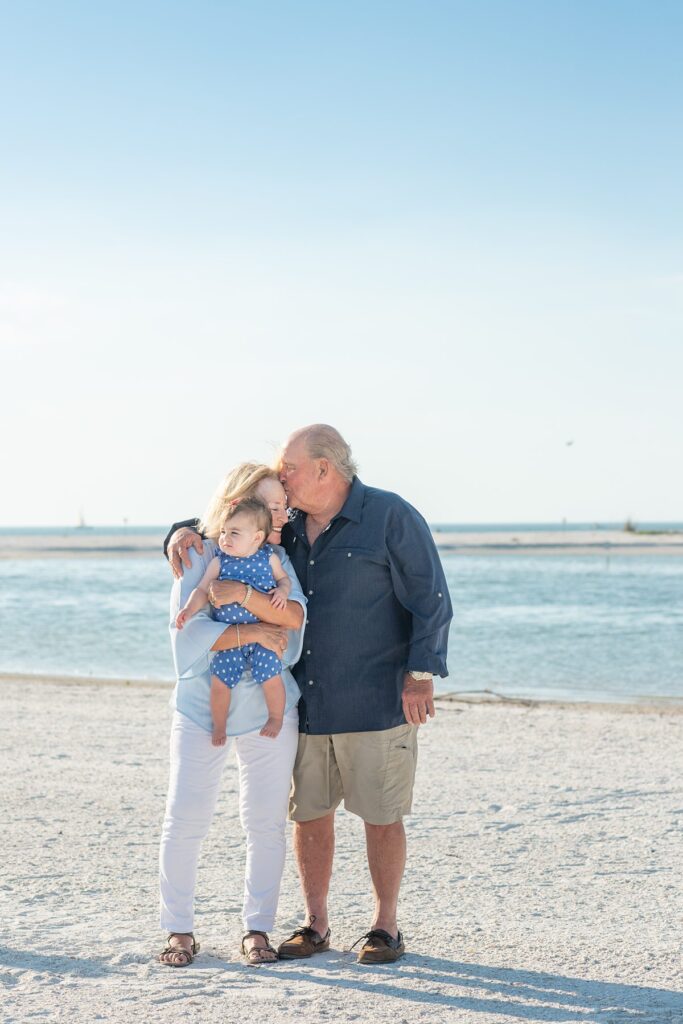 Family on a beach in Marco Island by Mikkel Paige Photography.