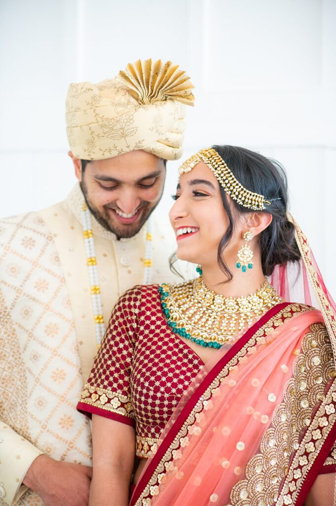 Bride and groom in traditional Indian wedding attire.