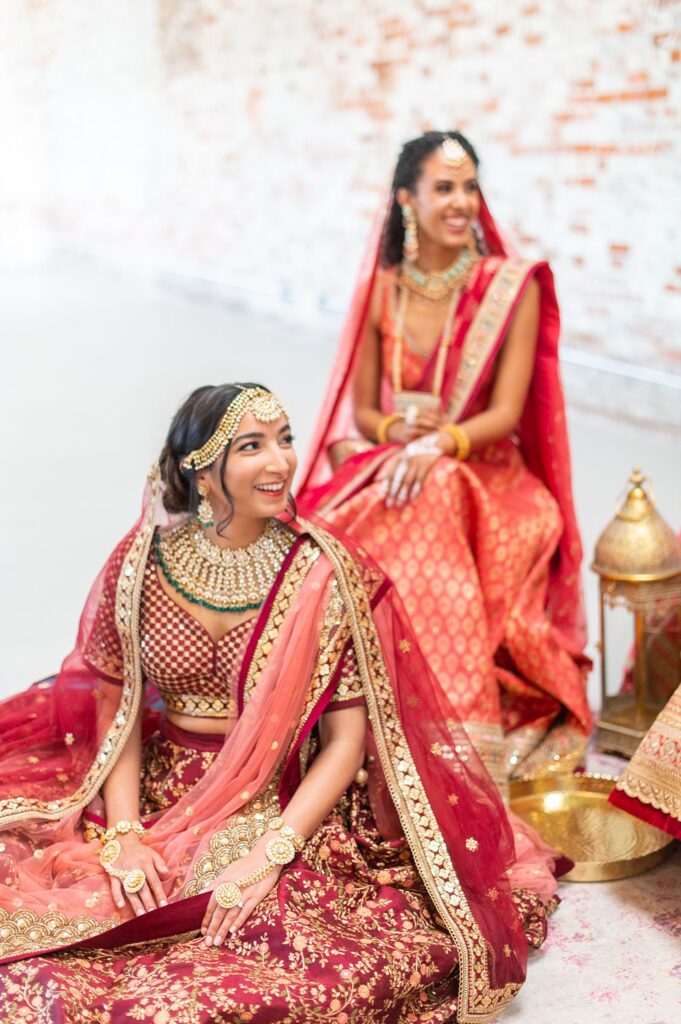 Indian wedding Mehndi party at The Graham Mill with the bride and bridesmaids dressed in colorful sari dresses.
