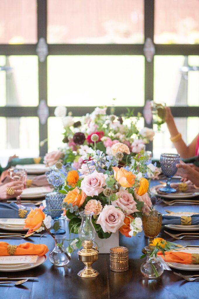 Colorful flowers by Wild Flora Flowers at an Indian wedding at The Graham Mill in NC.